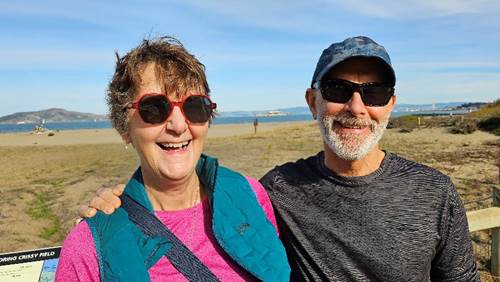 A person and person smiling for a picture