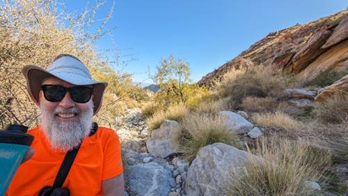 A person in a hat and sunglasses