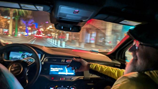 A person driving a car
Description automatically generated